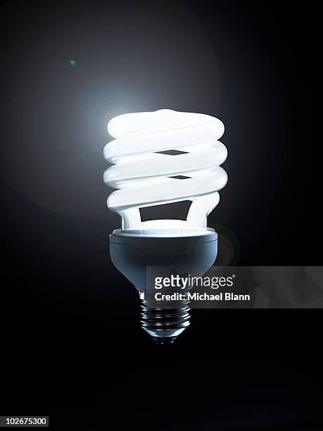 environmental energy - energy efficient lightbulb stock-fotos und bilder
