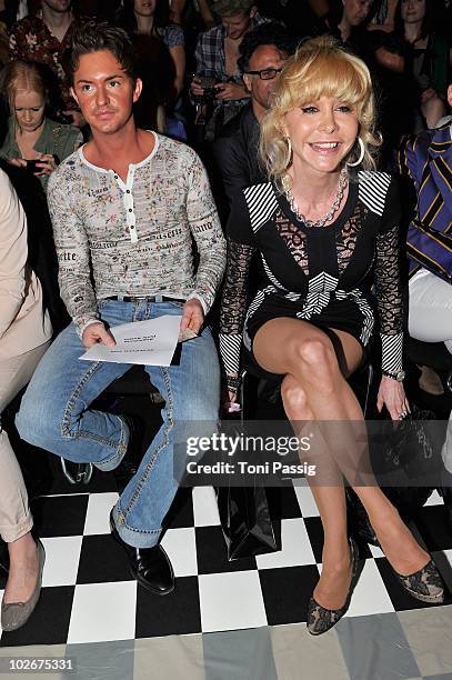 Dolly Buster and boyfriend Tim sit in front row at the Lena Hoschek Show during the Mercedes Benz Fashion Week Spring/Summer 2011 at Bebelplatz on...