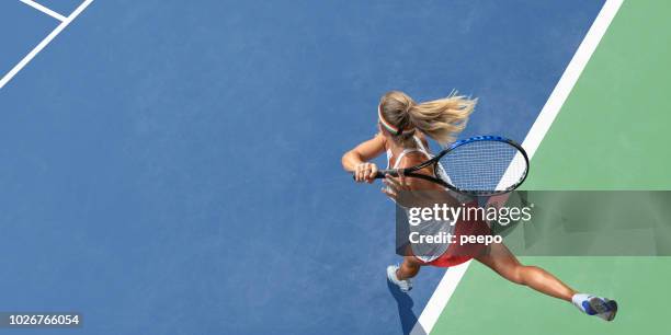 abstract top view of female tennis player after serve - sport competition stock pictures, royalty-free photos & images