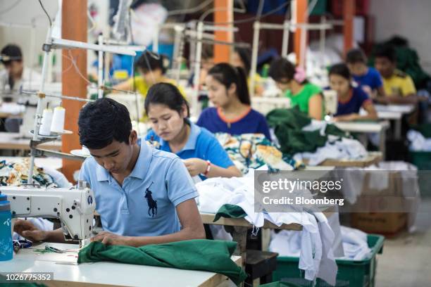 Workers use sewing machines to manufacture shirts at the Kaung Aunt Garment Manufacturing Co. Factory in Yangon, Myanmar, on Friday, Aug 31, 2018....