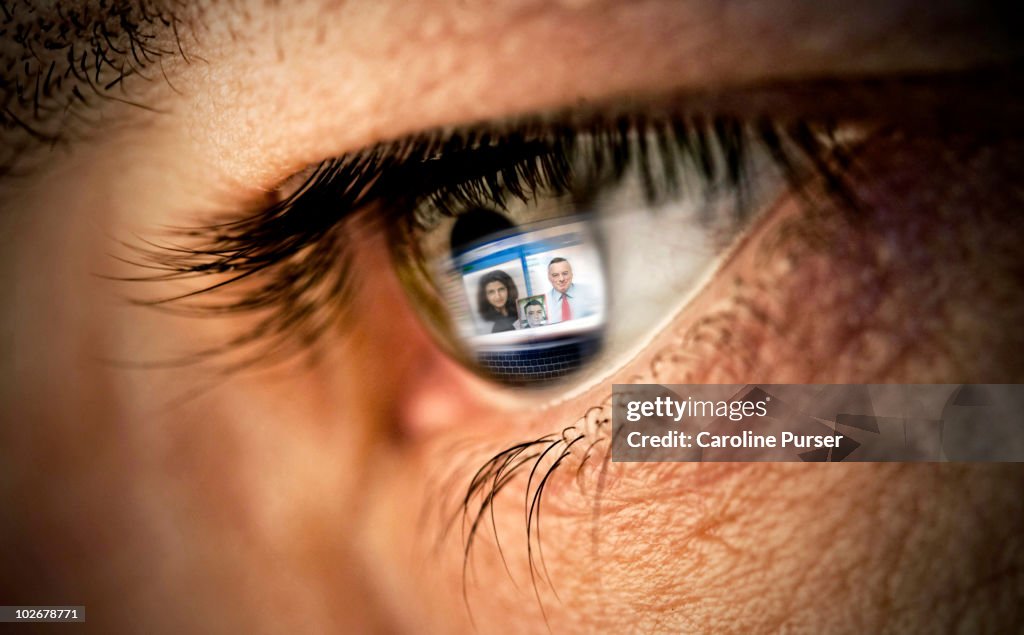 Reflection of video conference on computer in eye