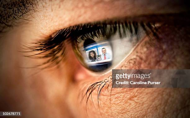 reflection of video conference on computer in eye  - big tech stock pictures, royalty-free photos & images