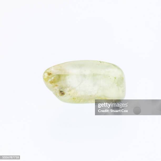 clear yellow prehnite on a white background. - prehnite stock pictures, royalty-free photos & images