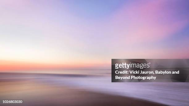 sunrise pastel colors abstract at jones beach in winter, long island, ny - vista marina fotografías e imágenes de stock