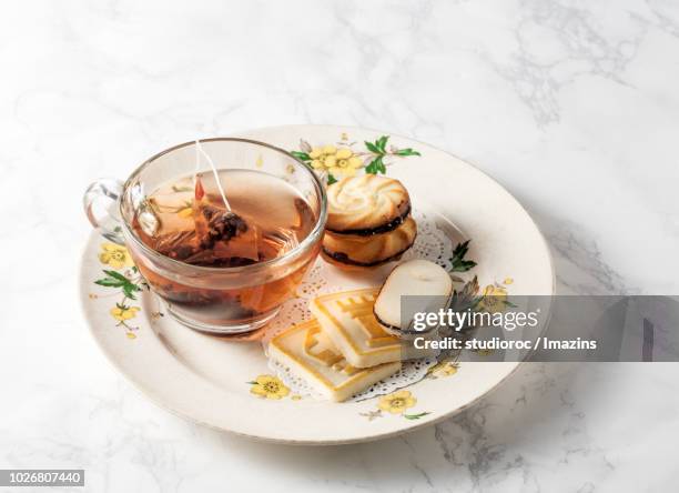 cookies with a cup of tea - 韓国　スイーツ ストックフォトと画像