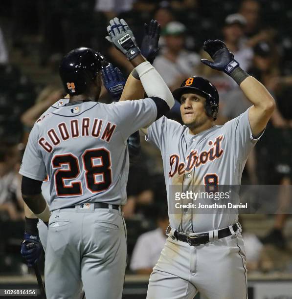 Mikie Mahtook of the Detroit Tigers celebrates his two run home run in the 8th inning with Niko Goodrum against the Chicago White Sox at Guaranteed...