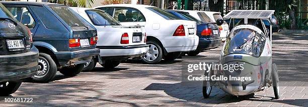 Xavier van Stappen of Belgium drives the three wheel electric car which he used to travel from Copenhagen to Ghana at the Court Classique on July 7,...