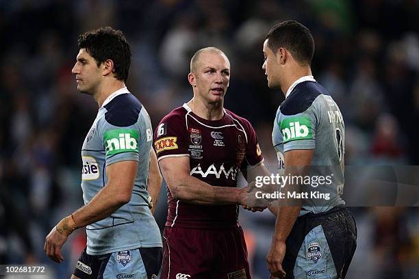 Darren Lockyer of the Maroons shakes hands with Jarryd Hayne of the Blues as Trent Barrett walks past during game three of the ARL State of Origin...