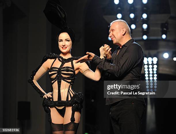 Dita Von Teese and designer Jean-Paul Gaultier walk the runway during the Jean-Paul Gaultier show as part of the Paris Haute Couture Fashion Week...