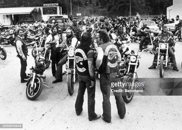 Ralph "Sonny" Barger, President of the Hell's Angels and an unidentified member from the New York chapter standing in front of a group of Hell's...