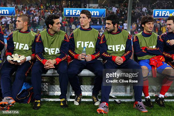 Fernando Torres of Spain sits on the substitutes bench with team mates ahead of the 2010 FIFA World Cup South Africa Semi Final match between Germany...