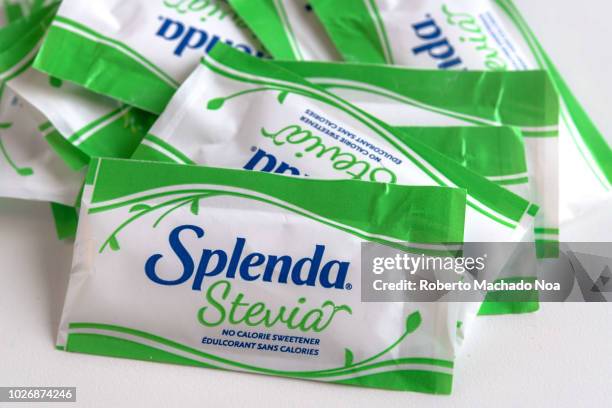 Splenda Stevia small individual packs over a white background.