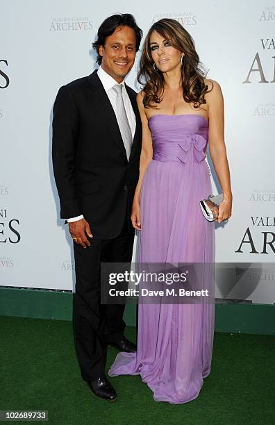 Arun Nayar and Elizabeth Hurley attend the Valentino Garavani Archives Dinner Party on July 7, 2010 in Versailles, France.