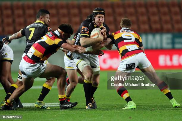 Wellington's Thomas Waldrom is tackled during the round four Mitre 10 Cup match between Waikato and Wellington on September 5, 2018 in Hamilton, New...