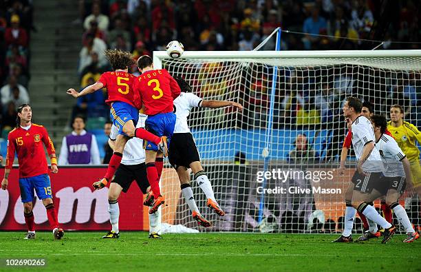 Carles Puyol of Spain scores his side's first goal from a header from a corner kick during the 2010 FIFA World Cup South Africa Semi Final match...