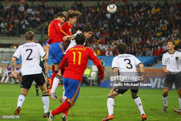 Carles Puyol of Spain scores the opening goal during the 2010 FIFA World Cup South Africa Semi Final match between Germany and Spain at Durban...