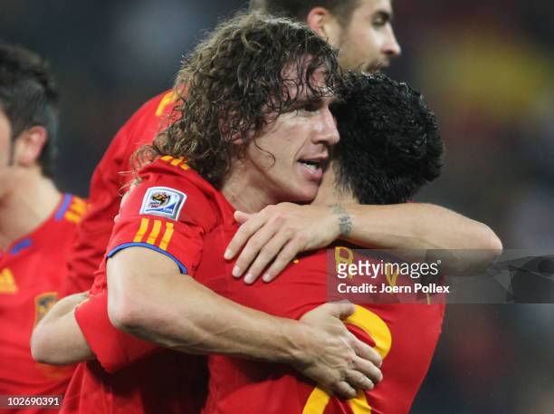 Carles Puyol of Spain celebrates scoring the opening goal with team mate Xavi Hernandez during the 2010 FIFA World Cup South Africa Semi Final match...