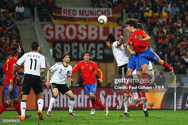 Carles Puyol of Spain heads the ball to score the opening goal during the 2010 FIFA World Cup South Africa Semi Final match between Germany and Spain...