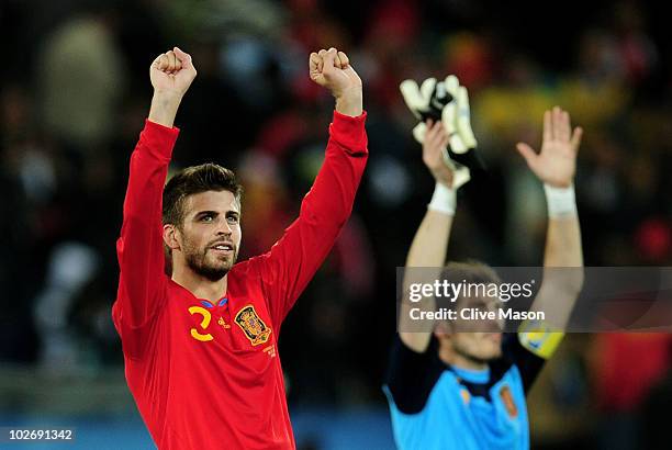 Gerard Pique and Iker Casillas of Spain celebrate victory and progress to the final during the 2010 FIFA World Cup South Africa Semi Final match...