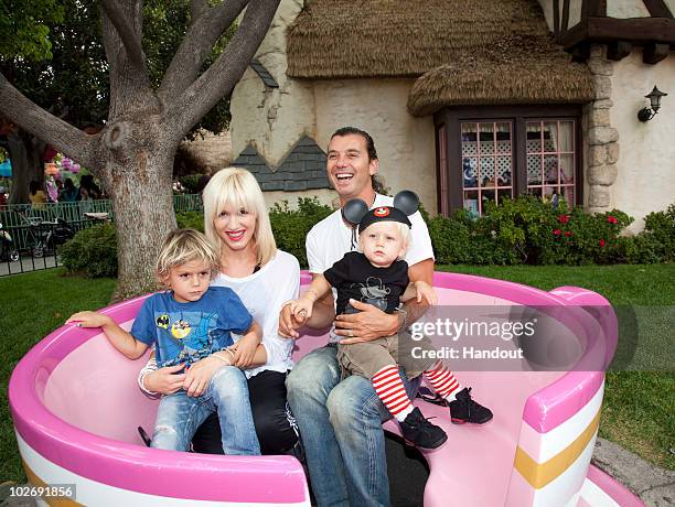 In this handout photo provided by Disney, Gwen Stefani and Gavin Rossdale, with their children, Kingston and Zuma visit the Mad Tea Party attraction...