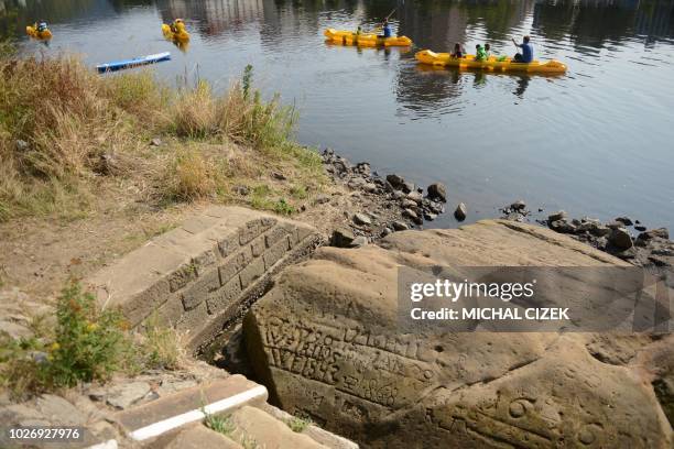 The so-called "Hunger Stone" is pictured in Decin, Czech Republic on August 29 by the low water level of the Elbe river. - Once an ominous harbinger...