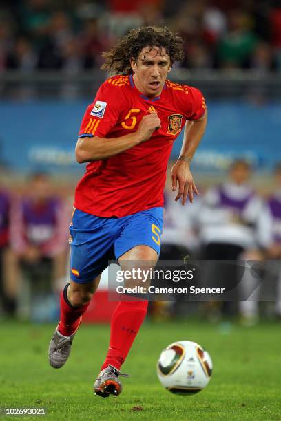 Carles Puyol of Spain runs with the ball during the 2010 FIFA World Cup South Africa Semi Final match between Germany and Spain at Durban Stadium on...