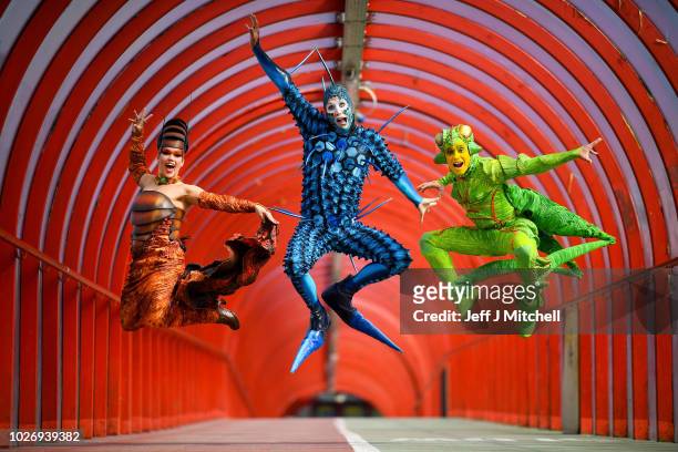 The cast of Cirque du Soleil's OVO Julia Tazie from Brazil, Jan Duther from Switzerland and Nathan Rivera-Drydak from Canada pose during a photo call...
