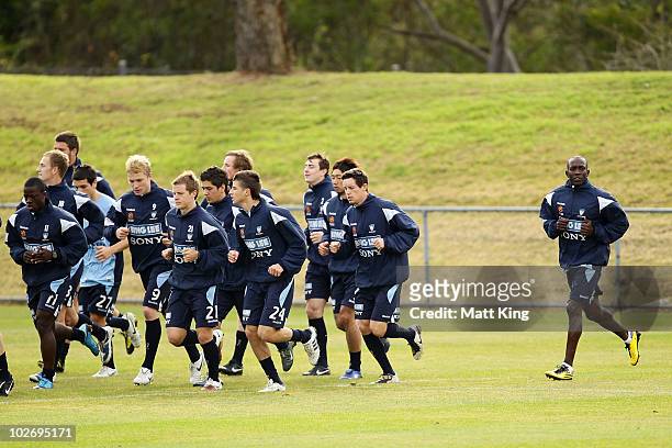 Dwight Yorke warms up behind team mates during a Sydney FC A-League training session ahead of the Sydney FC v Everton Tour Down Under match on July...