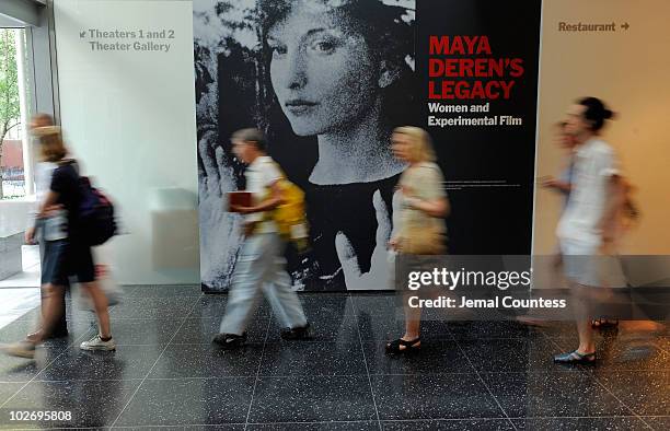 Line of movie goers file into the theater at MOMA to attend the Sally Potter Retrospective at The Museum of Modern Art on July 7, 2010 in New York...