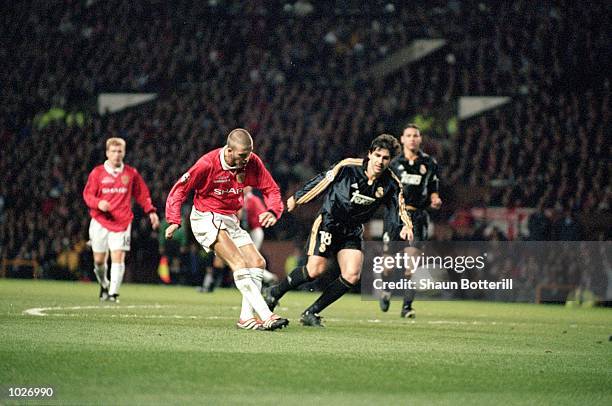 David Beckham scores the first goal for Manchester United during the UEFA Champions League quarter-final second leg against Real Madrid at Old...