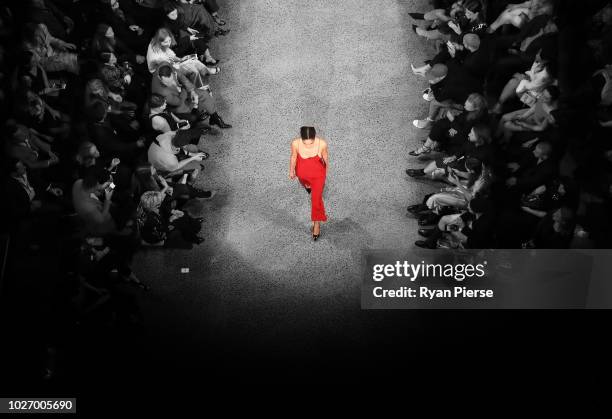 Image was altered with digital filters.) A model walks the runway during the Mercedes-Benz Presents Knuefermann show during New Zealand Fashion Week...