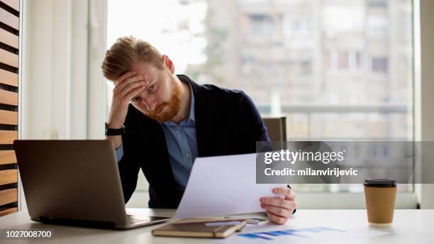 young businessman under stress - bankruptcy stock pictures, royalty-free photos & images