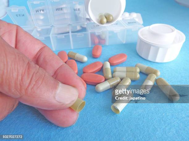 placebo effect. empty capsule - pillbox hat stock pictures, royalty-free photos & images