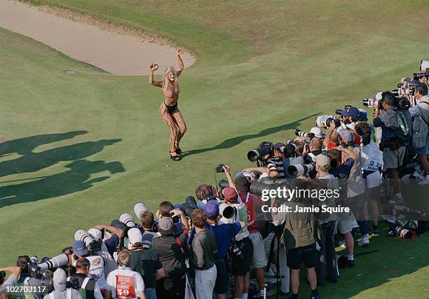 Tiger striped body painted streaker poses for the photographers during the British Open on 20 July 1997 at the Royal Troon Golf Club in Troon,...