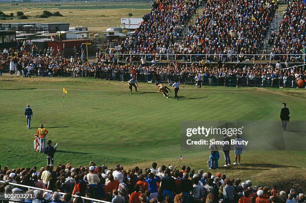 Streaker is tackled by police on the 18th green during the British Open on 21 July 1985 at the Royal St. George's Golf Club in Sandwich, Kent,...