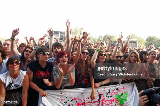 Music Fans in the front row of the audience during the final day of Les Eurockeenes Festival at Malsaucy on July 4, 2010 in Belfort, France.