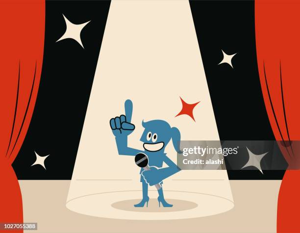 illustrazioni stock, clip art, cartoni animati e icone di tendenza di donna blu sorridente (host) sul palco con microfono e riflettori - presentatore di giochi televisivi