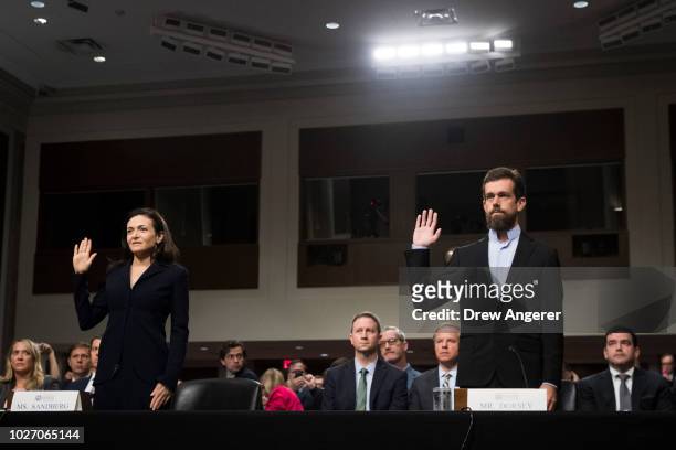 Facebook chief operating officer Sheryl Sandberg and Twitter chief executive officer Jack Dorsey are sworn-in for a Senate Intelligence Committee...