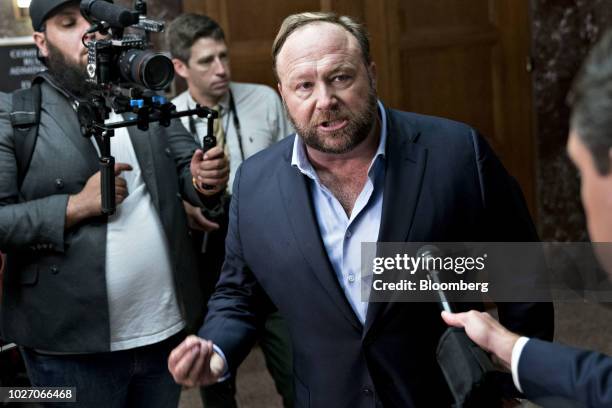 Alex Jones, radio host and creator of the website InfoWars, speaks to members of the media outside a Senate Intelligence Committee hearing in...