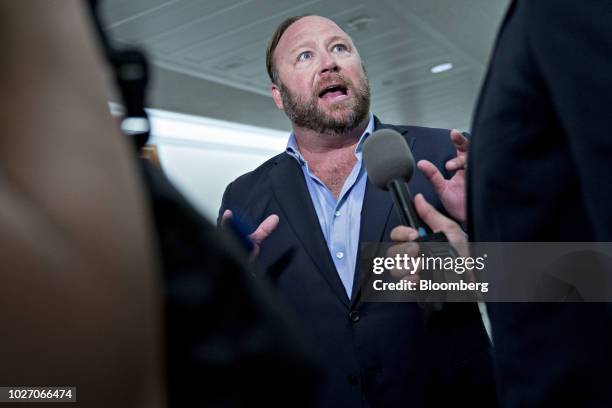 Alex Jones, radio host and creator of the website InfoWars, speaks to members of the media outside a Senate Intelligence Committee hearing in...