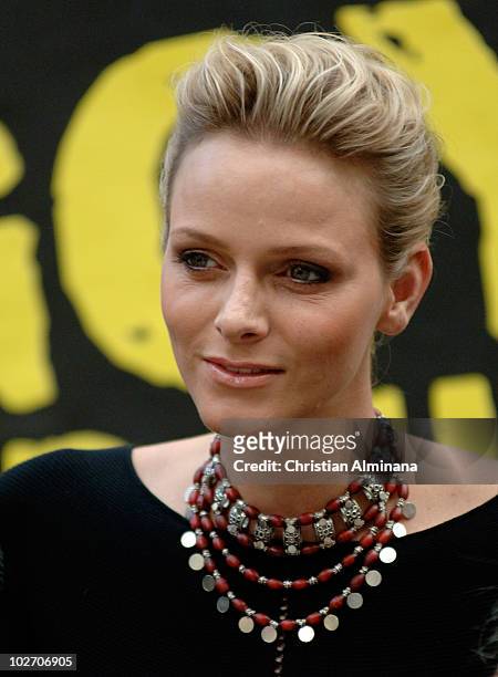 Former South African Olympic backstroke swimmer and fiancée of Prince Albert II of Monaco, Charlene Wittstock poses before an open-air concert on...