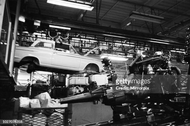 General scenes inside the Ford motor factory in Dagenham, Essex showing cars on the production line. 24th January 1964.