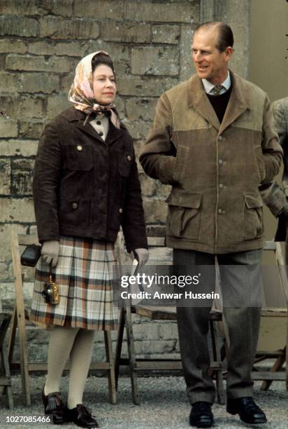 Queen Elizabeth ll holds her her gold Rollei camera during a visit to the Badminton Horse Trials with Prince Philip, Duke of Edinburgh on April 26,...