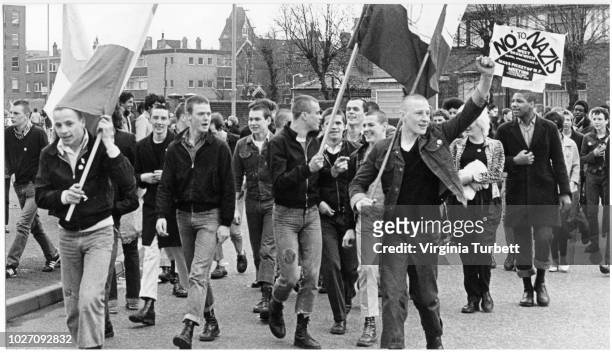 Marchers dressed in skinhead fashions take part in an anti-National Front protest in West Bromwich on 28th April 1979.