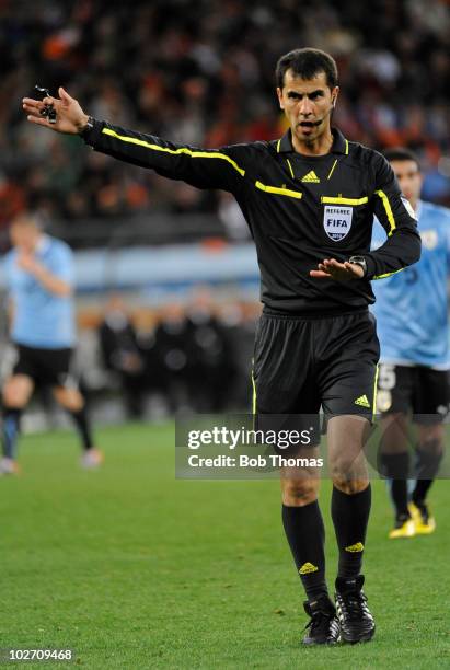 Referee Ravshan Irmatov during the 2010 FIFA World Cup South Africa Semi Final match between Uruguay and the Netherlands at Green Point Stadium on...