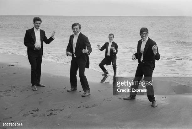 English instrumental group The Shadows pictured together on a beach in the Canary Islands, Spain during filming of the film musical Wonderful Life...
