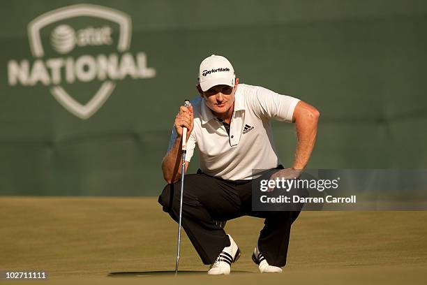 Justin Rose of England lines up a putt during the fourth round of the AT&T National at Aronimink Golf Club on July 4, 2010 in Newtown Square,...