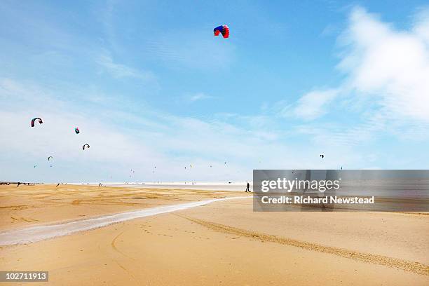 kite boarder on beach - distant stock pictures, royalty-free photos & images