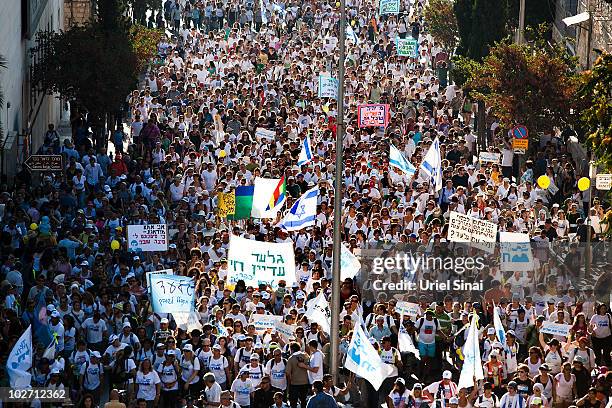 Thousands of Gilad Shalit supporters calling for his release march into Jerusalem during the last day of a 200-kilometre 12-day protest march from...