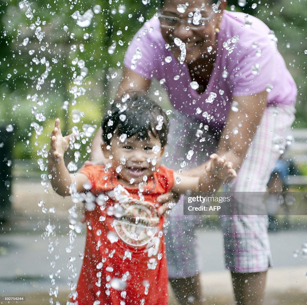A young boy and his mother play in a wat